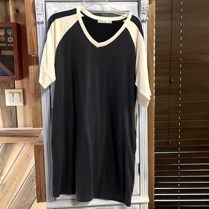 Another Love brand navy blue with white sleeves. Size Large. New with tags